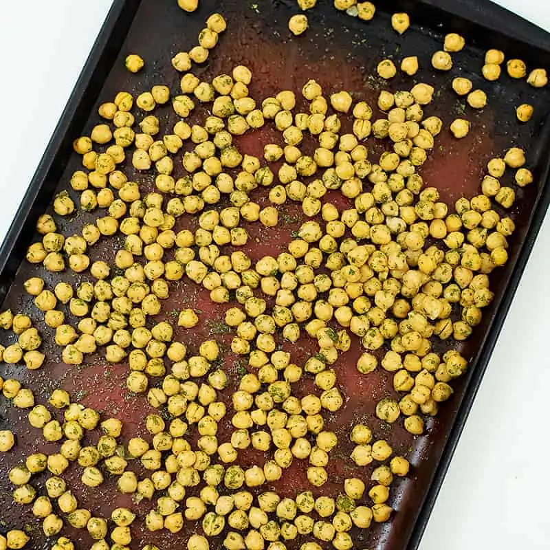 Baking sheet full of ranch roasted chickpeas before cooking