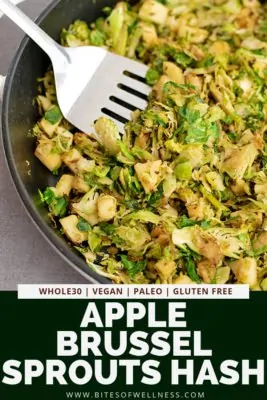 Large skillet filled with apple brussel sprouts hash with a silver spatula digging into the hash with pinterest text on the bottom