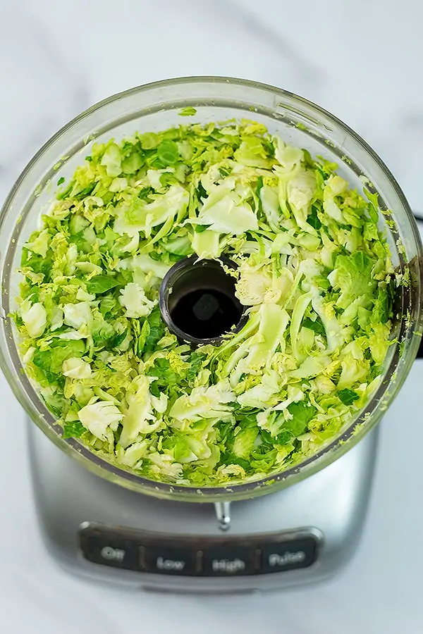 Shredded brussel sprouts in the food processor
