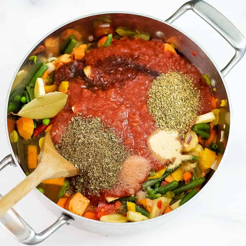 Vegetable soup ingredients in the pot before stirring