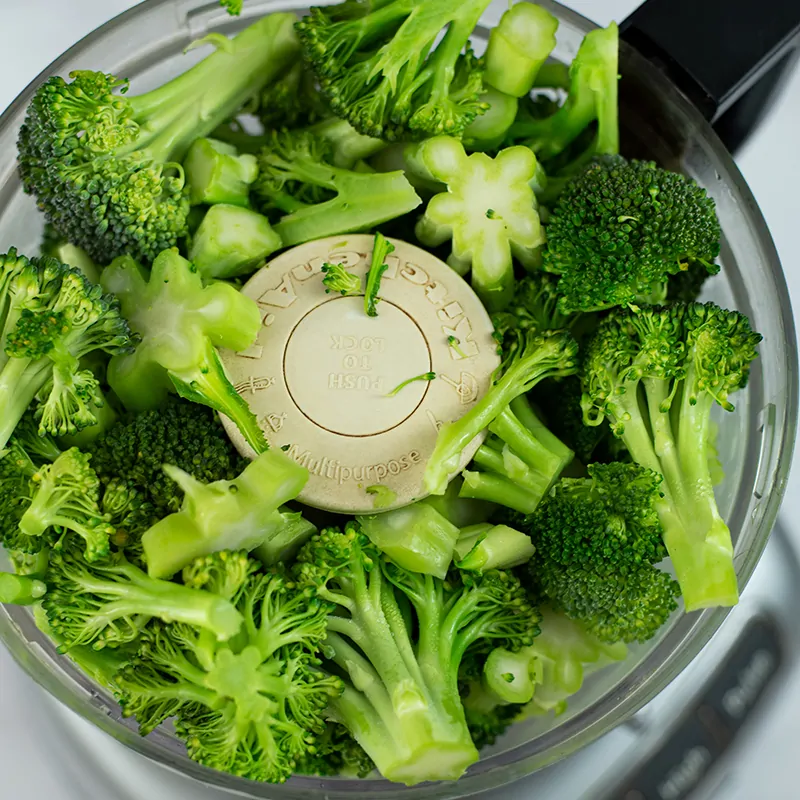 Broccoli in a food processor after steaming.