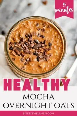 Glass jar filled with mocha overnight oats.