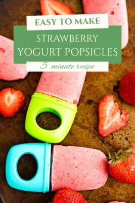 Strawberry yogurt popsicles on a sheet pan.