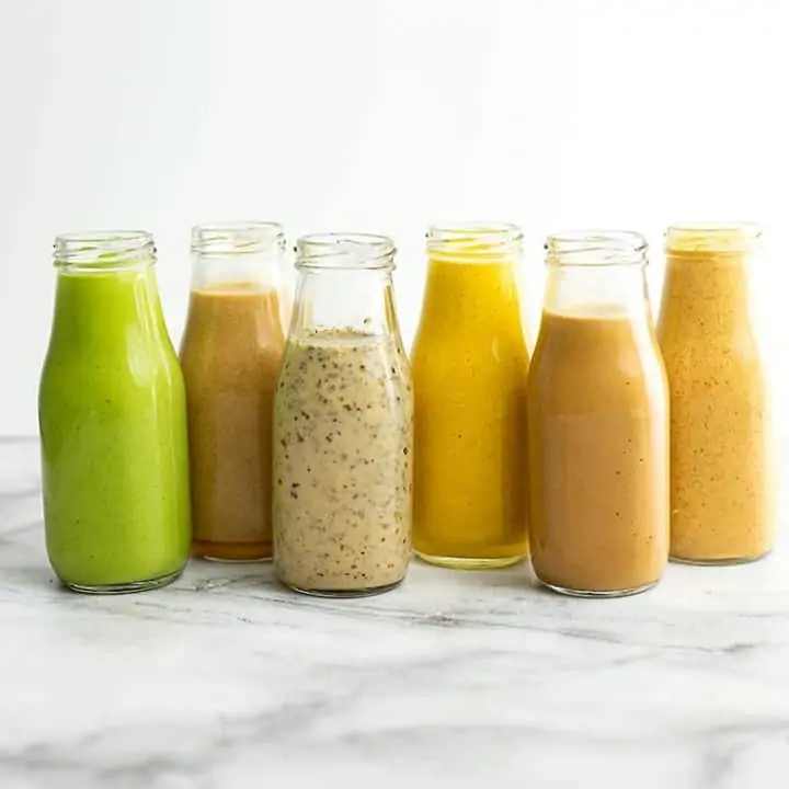 6 Healthy Salad Dressing Recipes in glass bottles