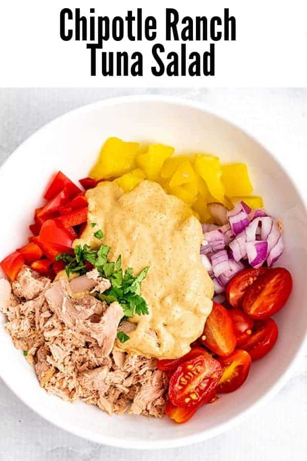 Bowl filled with Chipotle Ranch Tuna Salad ingredients before stirring.