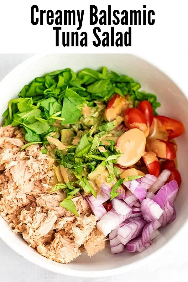 Bowl filled with Creamy Balsamic Tuna Salad ingredients before stirring.