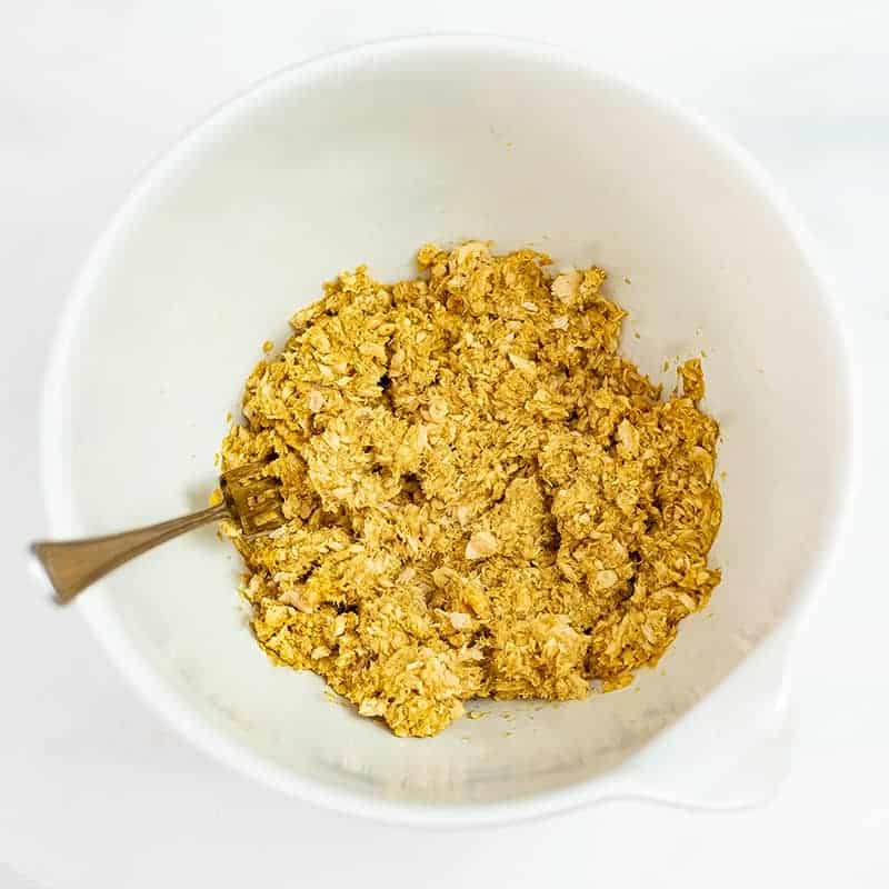 Large mixing bowl filled with curry salmon patty mixture