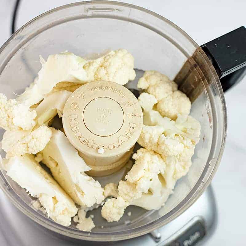 Chopped cauliflower in a food processor.