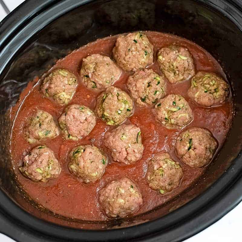 Raw turkey meatballs in marinara in slow cooker