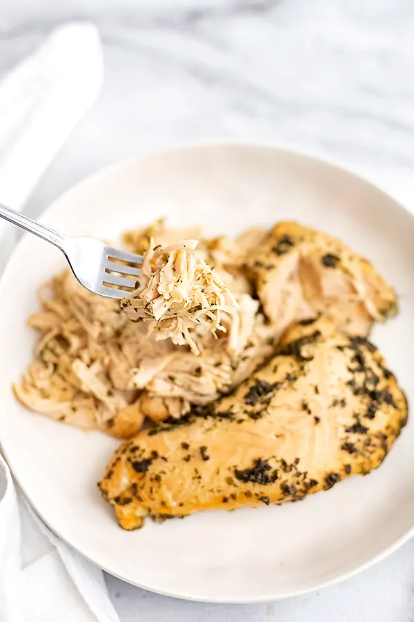 Shredded ranch chicken on a fork.