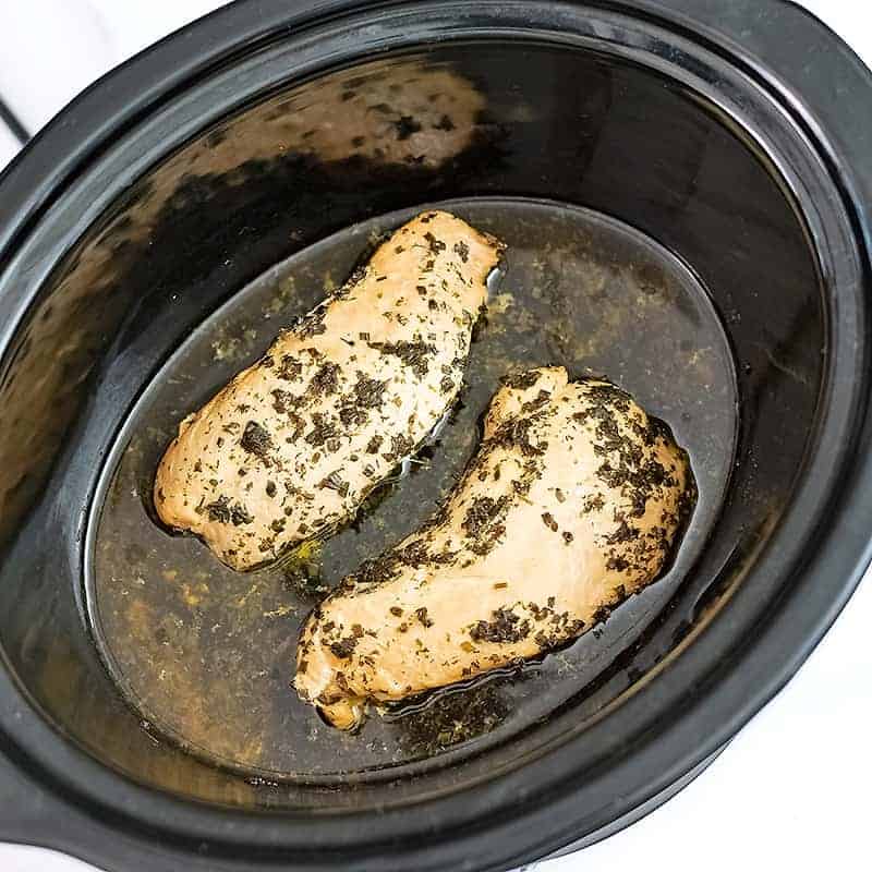 Crockpot filled with ranch chicken before shredding.