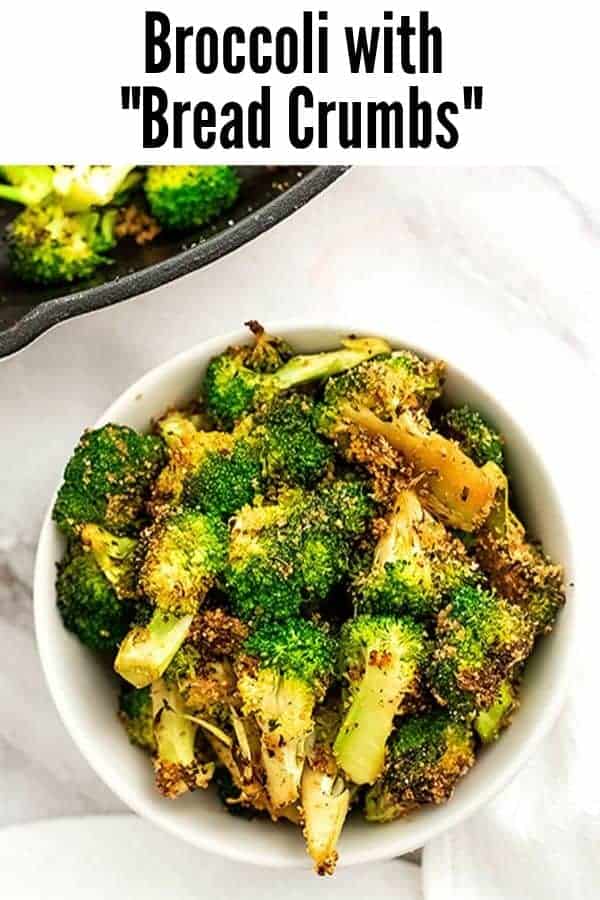 White bowl filled with bread crumb toppedbroccoli.
