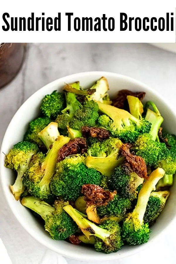 White bowl filled with sun dried tomato broccoli.