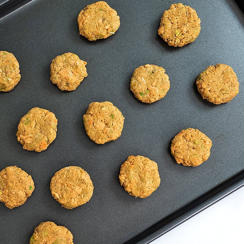 Salmon bites on baking sheet before baking.