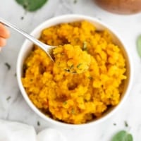 Spoon full of butternut squash risotto.