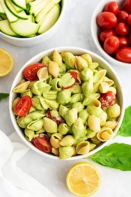 Creamy tahini pesto on top of pasta and veggies.