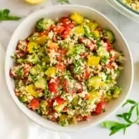 Cauliflower tabbouleh in a large white bow.