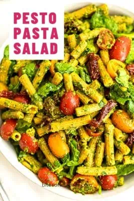 white bowl filled with pesto pasta salad