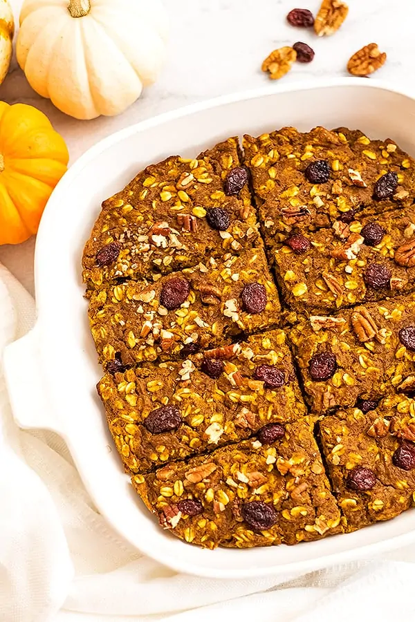 Pumpkin breakfast bars in white baking pan.