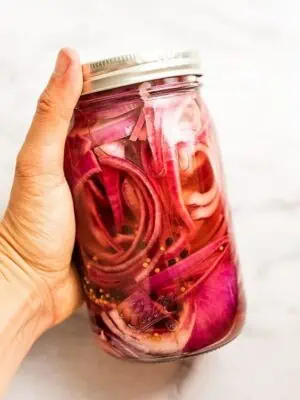Glass jar of Whole30 pickled red onions.