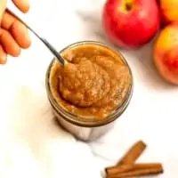 Spoonful of apple butter from a jar.