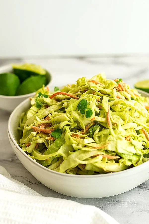 Small bowl of creamy cilantro lime slaw.