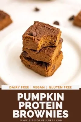 Pumpkin brownie with a bite removed on a plate.