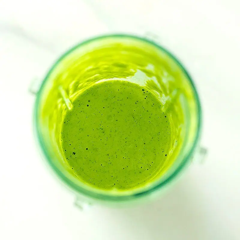 Cilantro lime dressing in blender after blending.