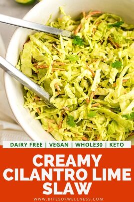 Tongs in a bowl full of creamy cilantro lime slaw.