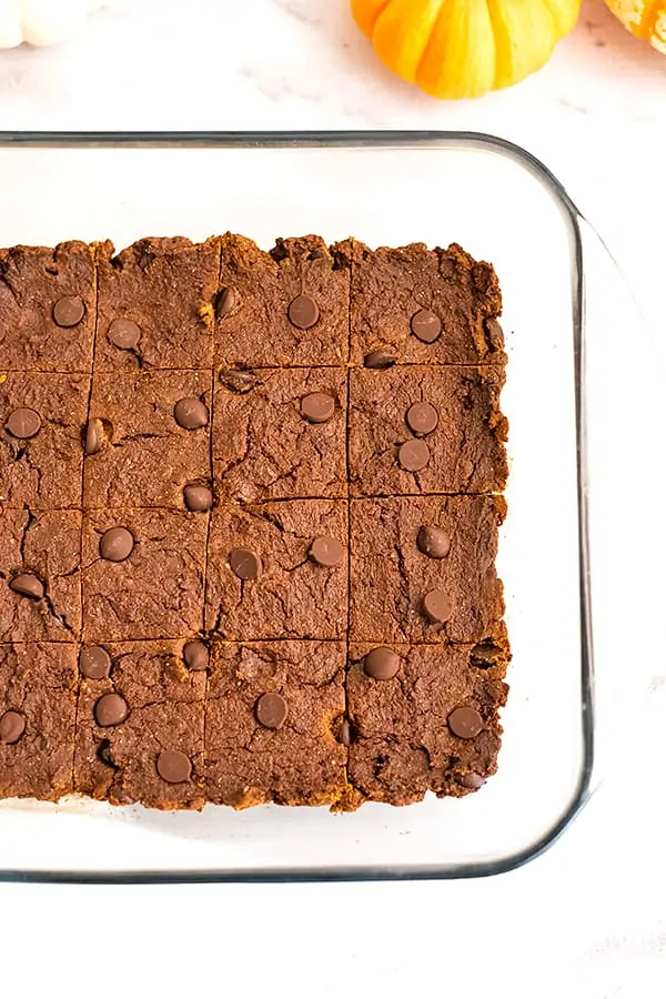 Pumpkin protein brownies in a glass baking dish.