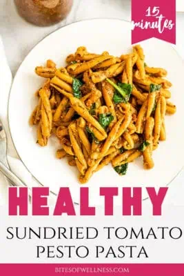 Large pot filled with sundried tomato pesto pasta.