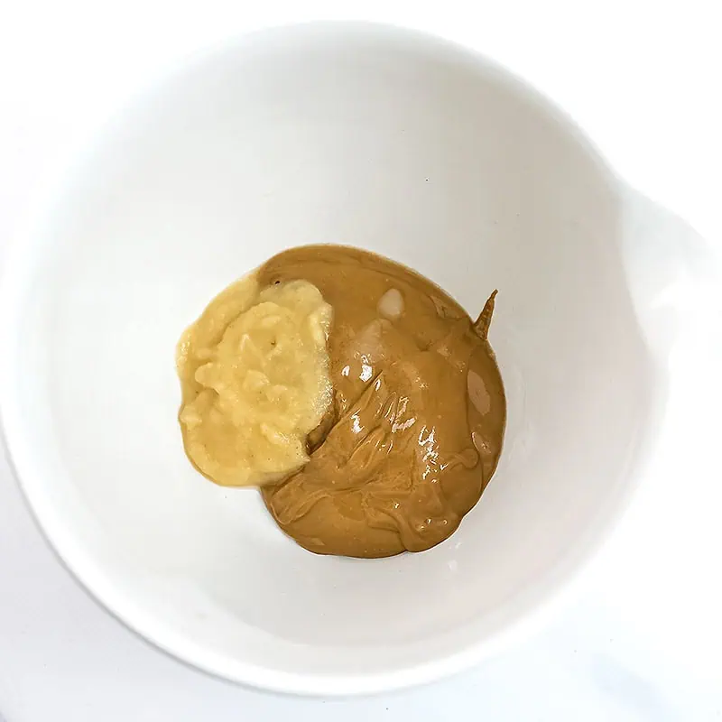Peanut butter and apple sauce in a bowl before blending.