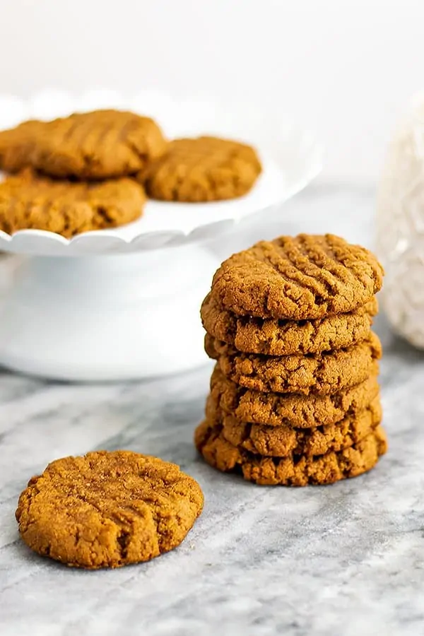 Protein peanut butter cookies stacked on top of each other.