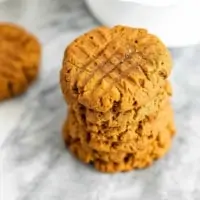 Large stack of peanut butter protein cookies.