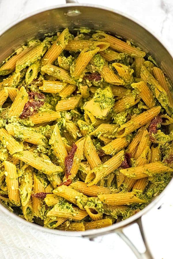 Silver pot filled with pesto tuna pasta after stirring.