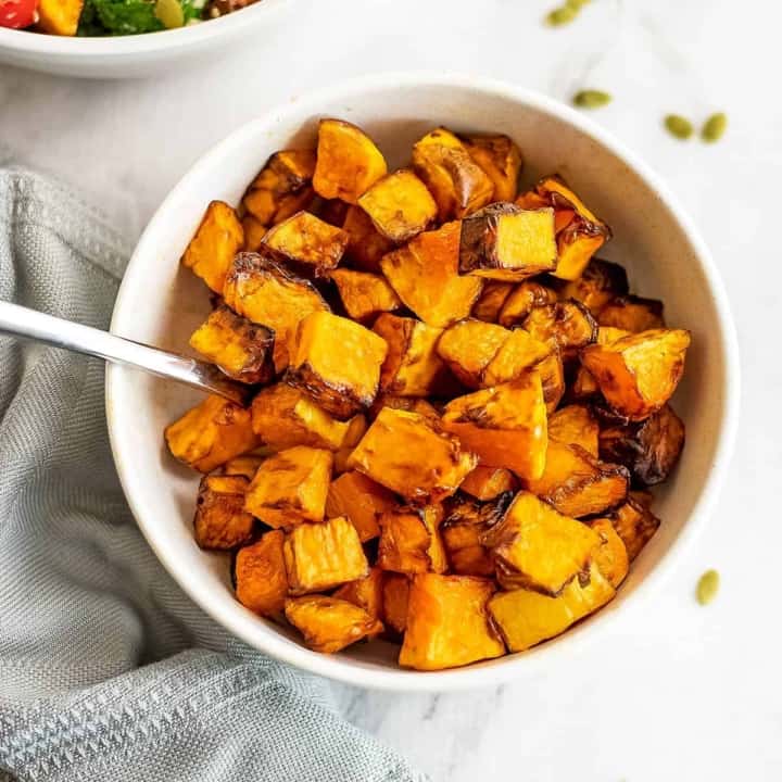 Bowl filled with air fryer butternut squash.