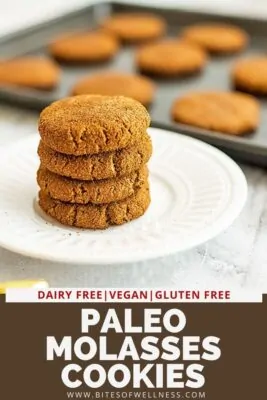 Paleo molasses cookies on a plate stacked 4 high.