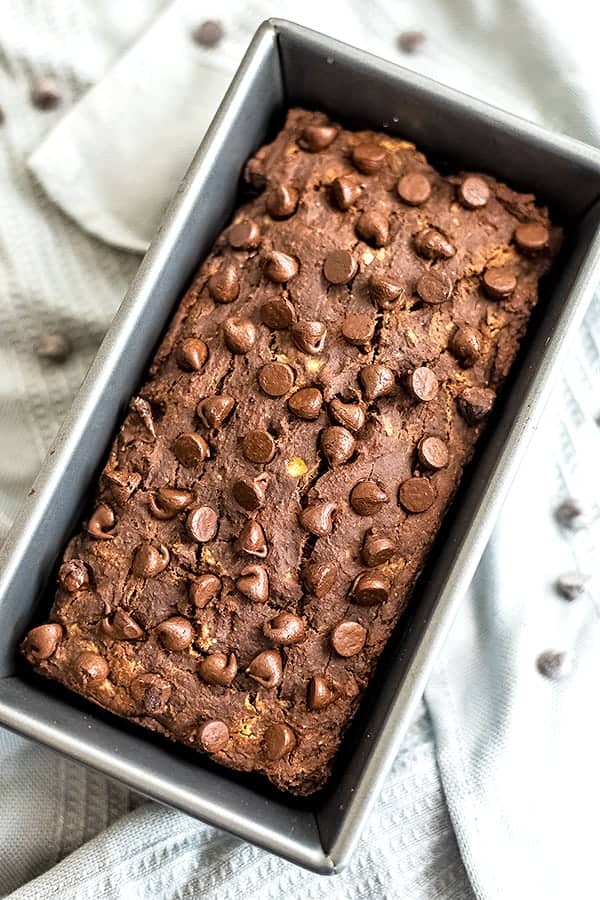 Chocolate protein banana bread in a loaf tin.