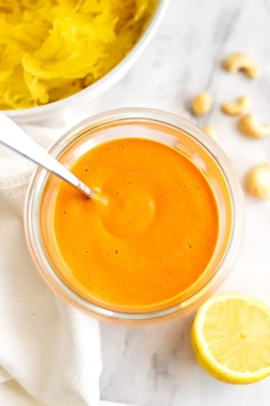 Jar filled with Whole30 roasted red pepper sauce.