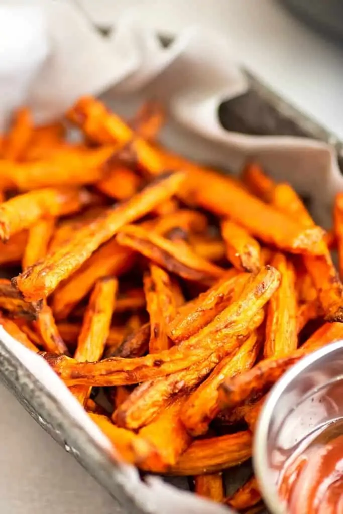 Air fryer carrot fries in a basket.