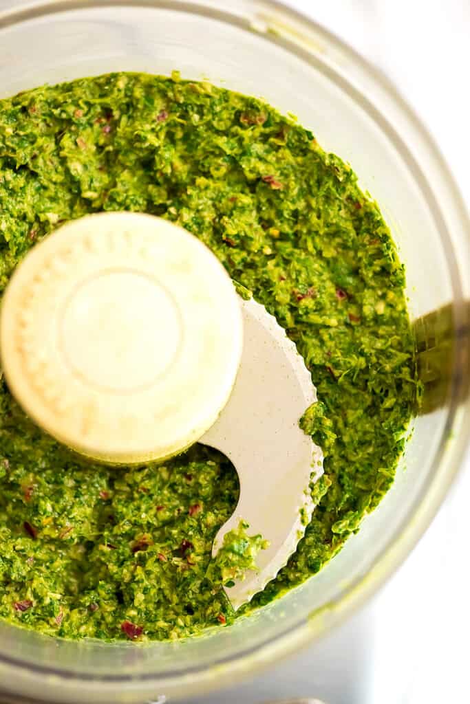 Food processor filled with Whole30 chimichurri sauce.