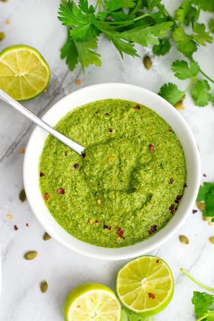 Large bowl filled with creamy chimichurri sauce.