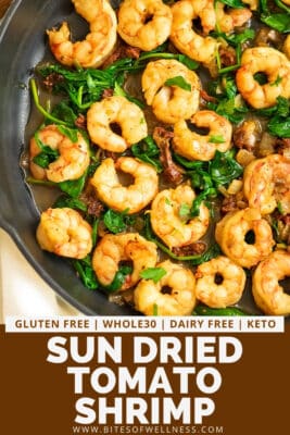 Cast iron skillet filled with sun dried tomato shrimp.
