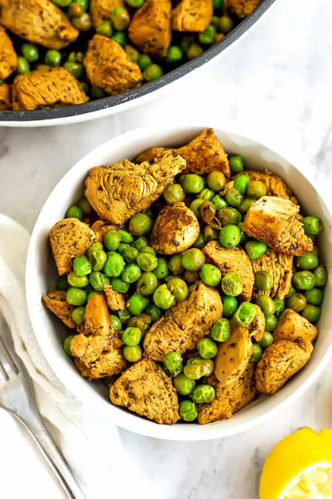 Italian chicken and peas in a bowl.