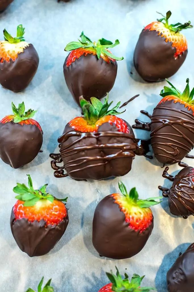 Chocolate drizzled on a chocolate covered strawberry.