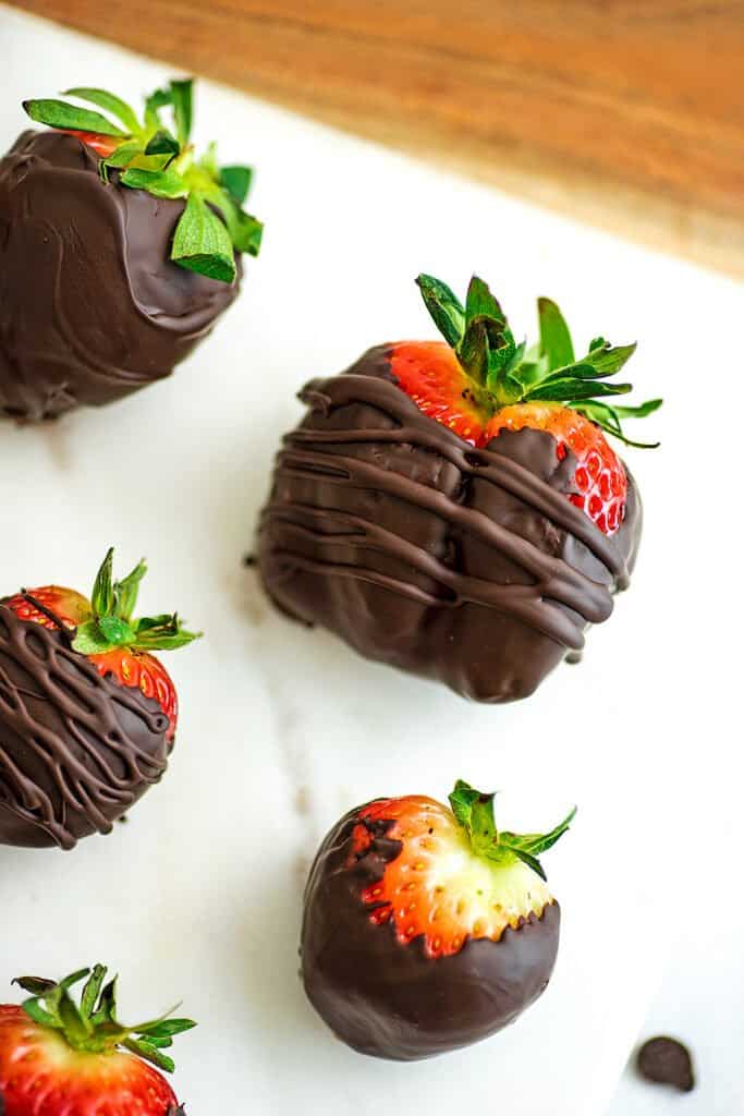 Large keto chocolate covered strawberry coated in chocolate drizzle.