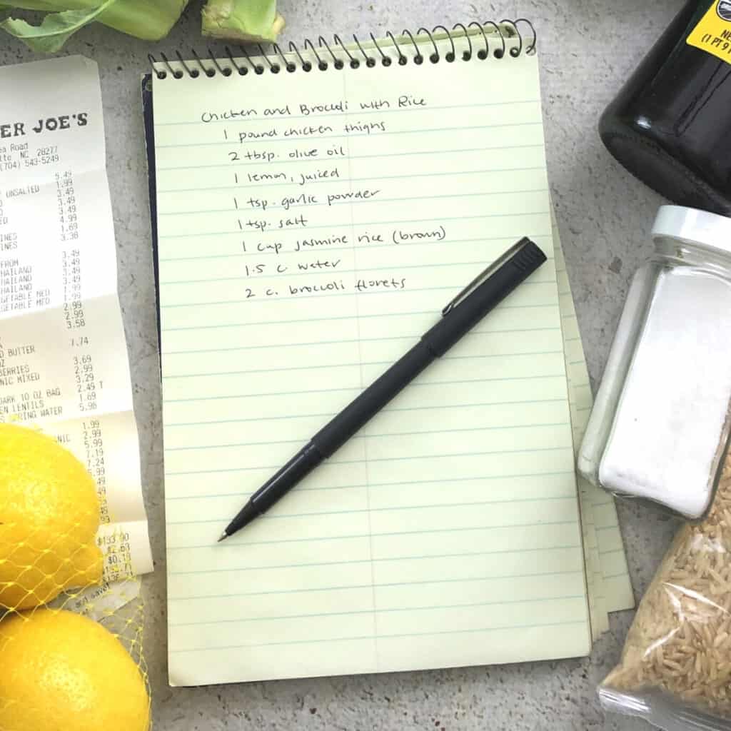 Note pad with recipe written and a pen.