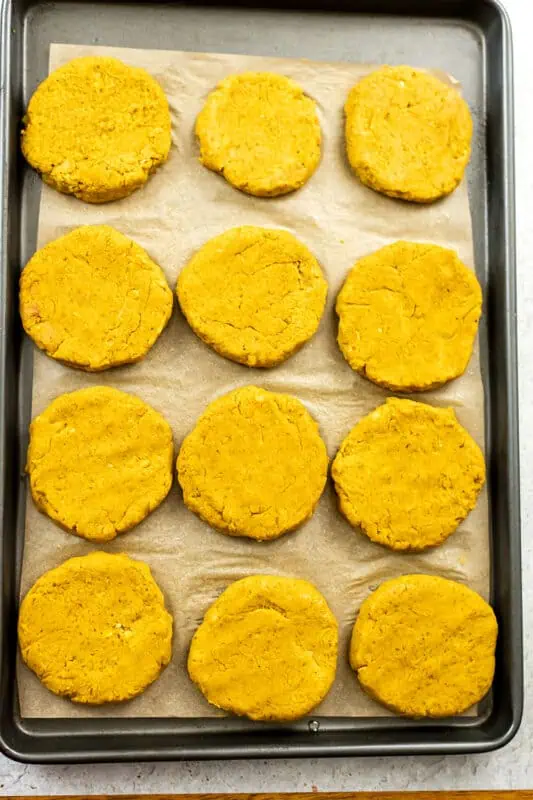 Sweet potato lentil burgers on baking sheet before baking.