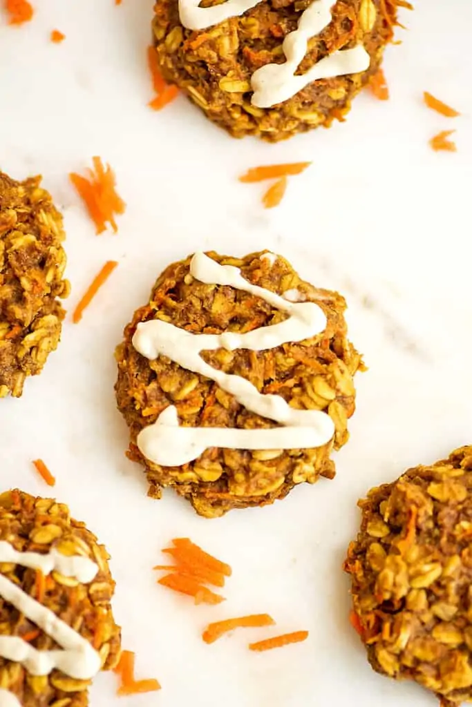 Single vegan carrot cake cookie with cashew frosting.