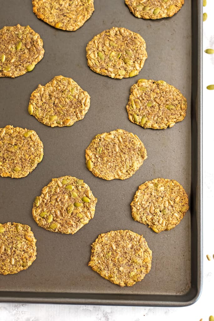 Seed crackers on a baking sheet after baking.